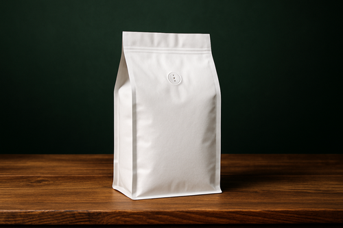 white coffee bag on top of a wooden table, dark green in the back ground
